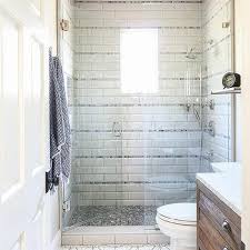 White Shower Tiles With Gray Accent