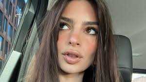 emily ratajkowski puts lipstick on her