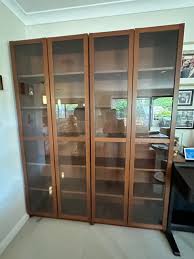 Two Double Fronted Bookcases With Glass