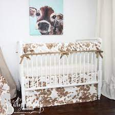tan cowhide gender neutral baby crib