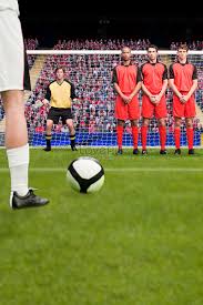 free kick in football match picture and