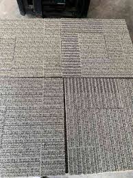 beige felt backed tile used carpet