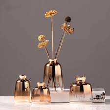 Set Of Four Rose Gold Fade Bottle Vases