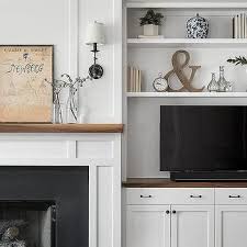 Tv In Built In Shelf Next To Fireplace
