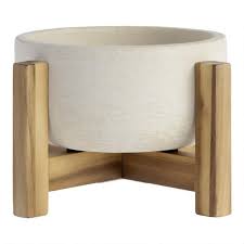 Visit your local at home store to purchase. Wide White Ceramic Planter With Wood Stand World Market