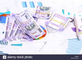 Picture Of New Indian Currency Rupees With Chart Paper And