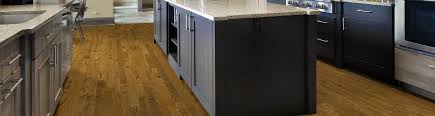 Demo the cabinets, demo the floor, install the hard wood, sand with stain + 2 coats of poly, install the cabinets, install the countertops, then, add the 3rd and final coat of polyurethane. Pre Finished Hardwood Floor Installation Service In Kansas City