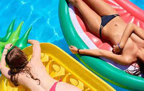 Topless Women Sunbathing In Pool by Stocksy Contributor Guille Faingold  - Stocksy