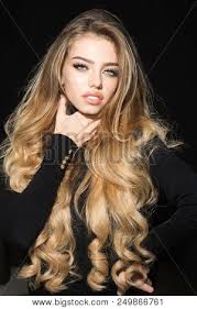 17 styles of blonde highlights that will transform your hair. Beautiful Girl With Long And Shiny Wavy Hair Blonde Model With Curly Hairstyle Woman Fashion Model