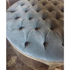 Constructed from eucalyptus wood, this chic ottoman is upholstered in rich velvet upholstery that is soft to the touch. Marie French Country Round Grey Blue Tufted Wood Round Coffee Table 41 W 50 W Kathy Kuo Home