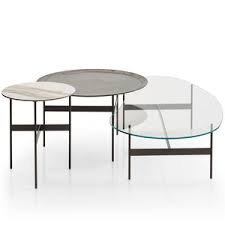 Curved metal legs are topped with a piece of tempered glass. Round Coffee Table Circular Coffee Table All Architecture And Design Manufacturers Videos