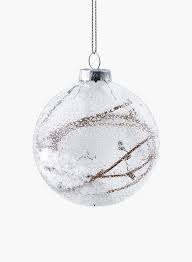assorted iced glass ornaments with snow