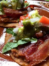 here is the hatch green chile salsa garnishing our refried bean and bacon tostadas great brunch