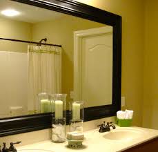 It'll adhere right to your mirror, so no extra room is needed around it. Remodelaholic Bathroom Mirror Frame Tutorial