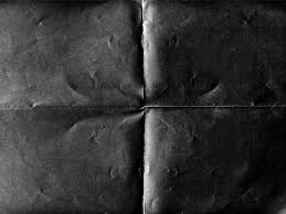 black folded paper photo texture