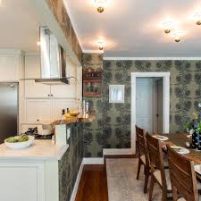 The next idea is available in this photo of an open style eclectic if your open kitchen and dining room is large enough, you can build a larger half wall for defining both spaces. Half Wall Between Kitchen And Dining Room Makes Both Spaces Feel Open Hgtv