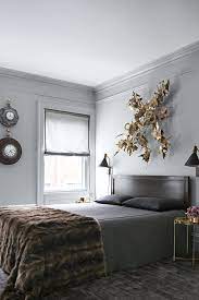 grey bedroom walls with brown furniture