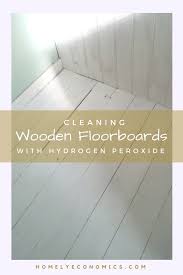 cleaning wooden floorboards with