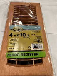 plastic floor register in oak grain