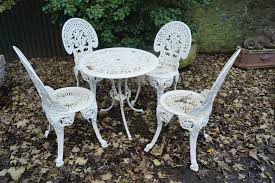 cast iron patio table and four chairs