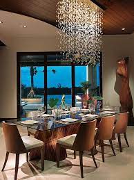 If you're looking to add a touch of elegance to your dining room, a chandelier is a great option as they had both design and light to the room. 10 Modern Chandeliers You Will Love Id Lights Tropical Dining Room Dining Room Contemporary Modern Chandelier Dining