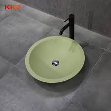 green round bathroom sink above counter