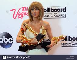 Taylor Swift Poses Backstage With The Awards For Top