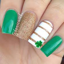 Patrick's day with this sparkly shamrock design. Golden Stripes And Green Shamrock Leaf Saint Patrick S Day Nail Art