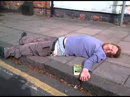 Drunk guy passed out on the sidewalk - YouTube