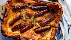 A roasted vegetable toad in the hole may not be trad but the best seasonal roots baked in balsamic & cooked in yorkshire pud batter are fab! Toad In The Hole With Red Onion Gravy Nicky S Kitchen Sanctuary