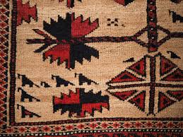 antique baluch rug with camel ground