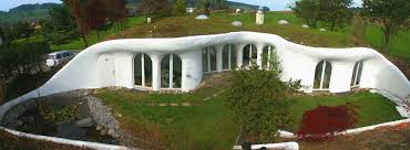 Today's earth berm or underground home is anything but a cave, but it is usually found nestled into the side. Earth Shelter Wikipedia