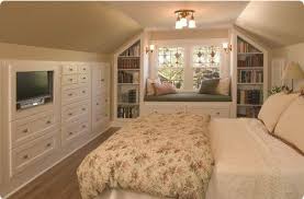 upstairs bedroom with sloped ceilings