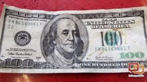 counterfeit 100 bills being ped in