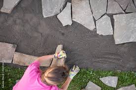 Girl Builder Laying And Grouting York