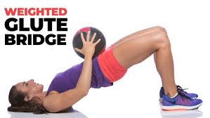 weighted glute bridge exercise