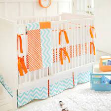 Blue And Orange Crib Bedding In Nursery