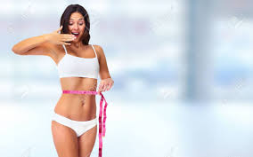 Young Woman With Measuring Tape Weight Loss And Dieting