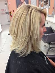 The best hairstyles for medium length hair include leaving your hair down with layers, waves, braids, ponytails, or curls. Barely There Angled Long Bob With Layers Highlighted With A Few Iridescent Gold Lowlights Angled Bob Hairstyles Hair Styles Haircuts For Medium Length Hair