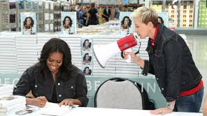 Michelle obama's book becoming shot to no. Michelle Obama Ellen Degeneres Visit Costco For Becoming Book Signing Ew Com