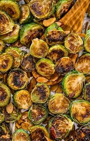 Place potatoes and brussels sprouts on a baking sheet and sprinkle bacon pieces over the top. Crack Brussels Sprouts The Best Roasted Brussels Sprouts Swanky Recipes