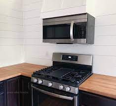faux vent hood with a mounted microwave