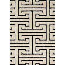 white and black geometric maze rug