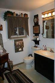 Outhouse bathroom decor in a country house offers a great opportunity to create a beautiful and functional interior in the original style. Ideas For A Primitive Look Bathroom The Shelf Over The Window Is Great Prim Primitive Bathrooms Primitive Bathroom Decor Primitive Country Bathrooms