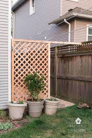 Simple trellis option one is supporting pole beans in the back bed to the left, and has been curled into tomato cages in the bed on the right. Build A Simple Diy Trellis Screen To Hide Ugly Areas In Your Backyard Practically Functional