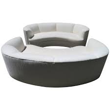 pair of curved kidney shaped sofas mid