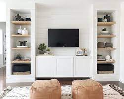 It includes wooden coffee and side tables along with brown leather sofas facing the television fitted to the white wainscoted wall. Simple Living Room With Tv Ideas You Have To See Decorface Com
