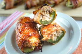 sausage stuffed jalapenos wrapped in