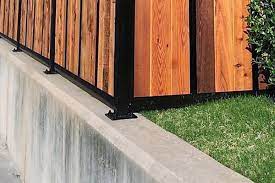 install a fence mounted to concrete