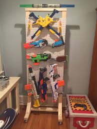 People interested in homemade nerf gun rack also searched for. Nerf Gun Display Rack Diy Diy Pegboard Nerf Gun Storage Moments With Mandi The Handle Of The Gun Is Carved Wood With A Plastic Overlay And It Has Some Other